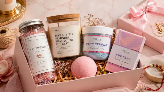 Salty Secrets Rakhi gift hamper under ₹1500 with handmade soap, whipped soap, bath bomb, bath salt and candle arranged as a self-care gift for sister.