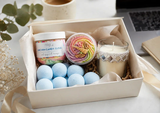 Corporate wellness gift hamper with Salty Secrets handmade soaps, whipped soap, bath bombs and candle arranged for employee gifting.